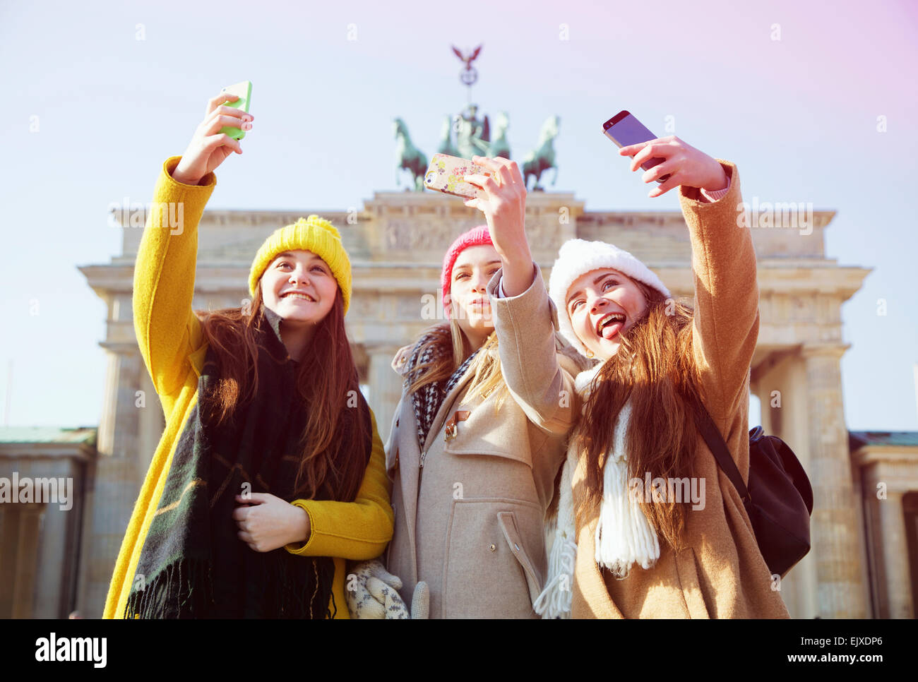 teenage-girls-taking-selfie-in-front-of-