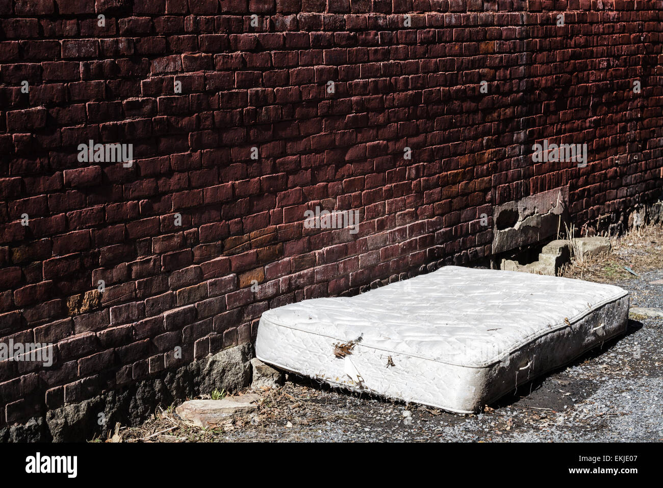 Old and dirty Abandoned Mattress in a Backstreet Stock Photo, Royalty