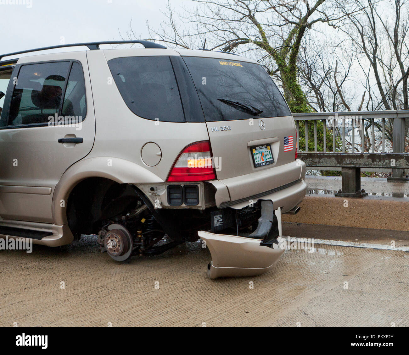 Missing wheel on car at an accident scene USA Stock Photo, Royalty