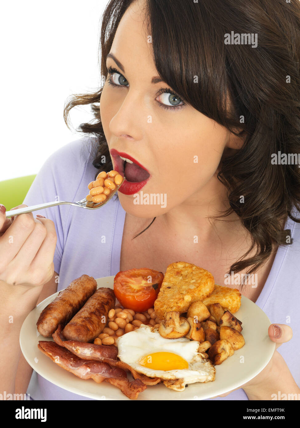 Stock Photo - Young Attractive Woman Eating a <b>Full English</b> Breakfast - young-attractive-woman-eating-a-full-english-breakfast-EMFT9K
