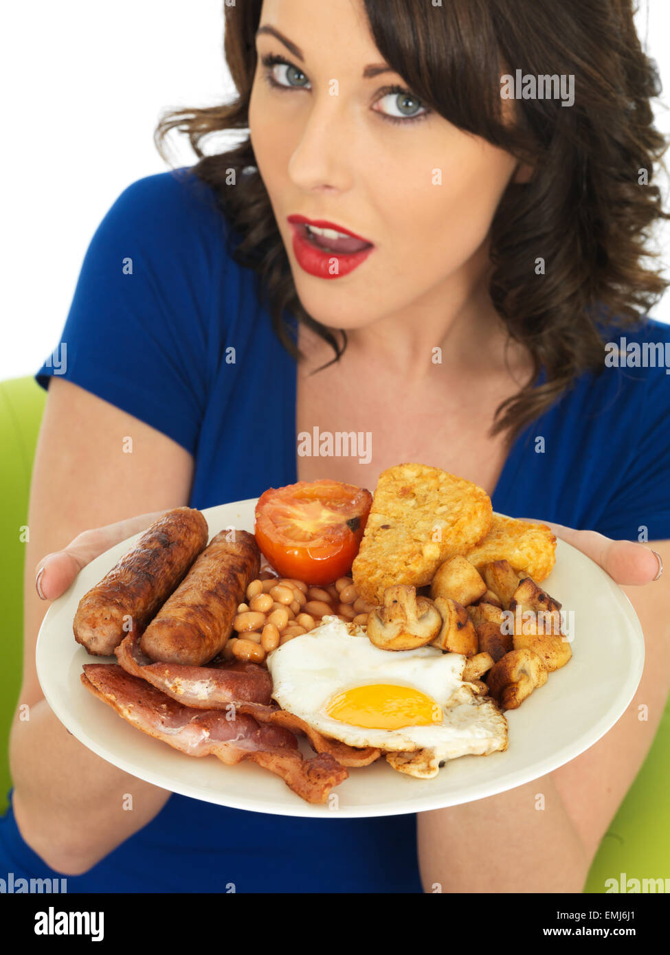 Stock Photo - Young Attractive Woman Eating a <b>Full English</b> Breakfast - young-attractive-woman-eating-a-full-english-breakfast-EMJ6J1
