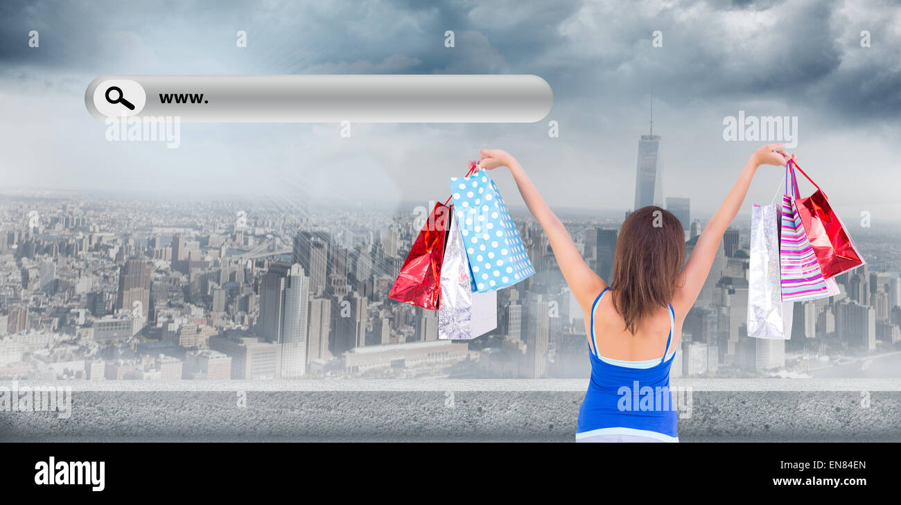 Composite Image Of Rear View Of A Brunette Woman Raising Shopping Bags