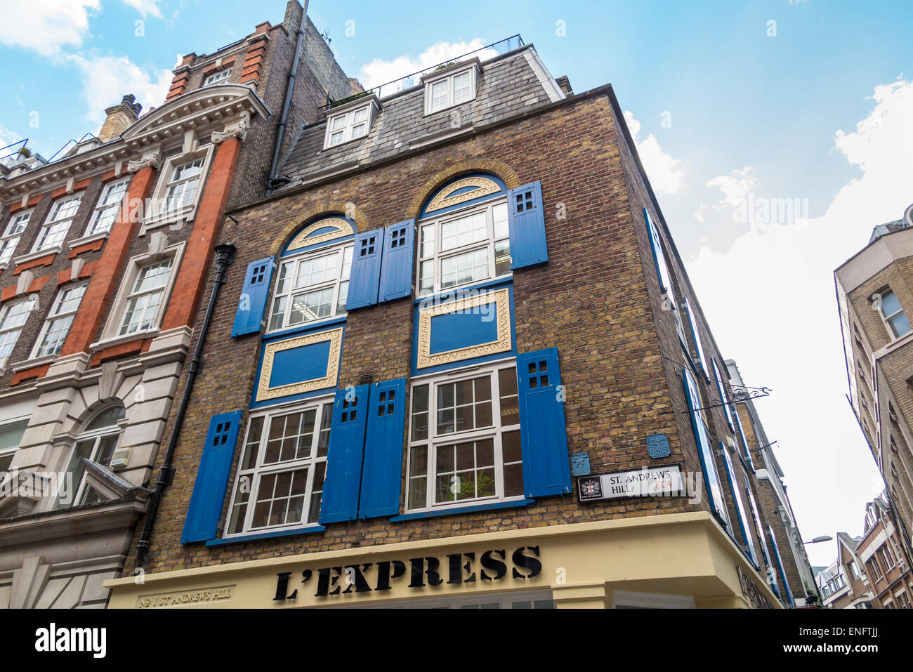 Converted Warehouse victorian converted warehouse building with blue window shutters Converted Warehouse victorian converted warehouse building with blue window shutters