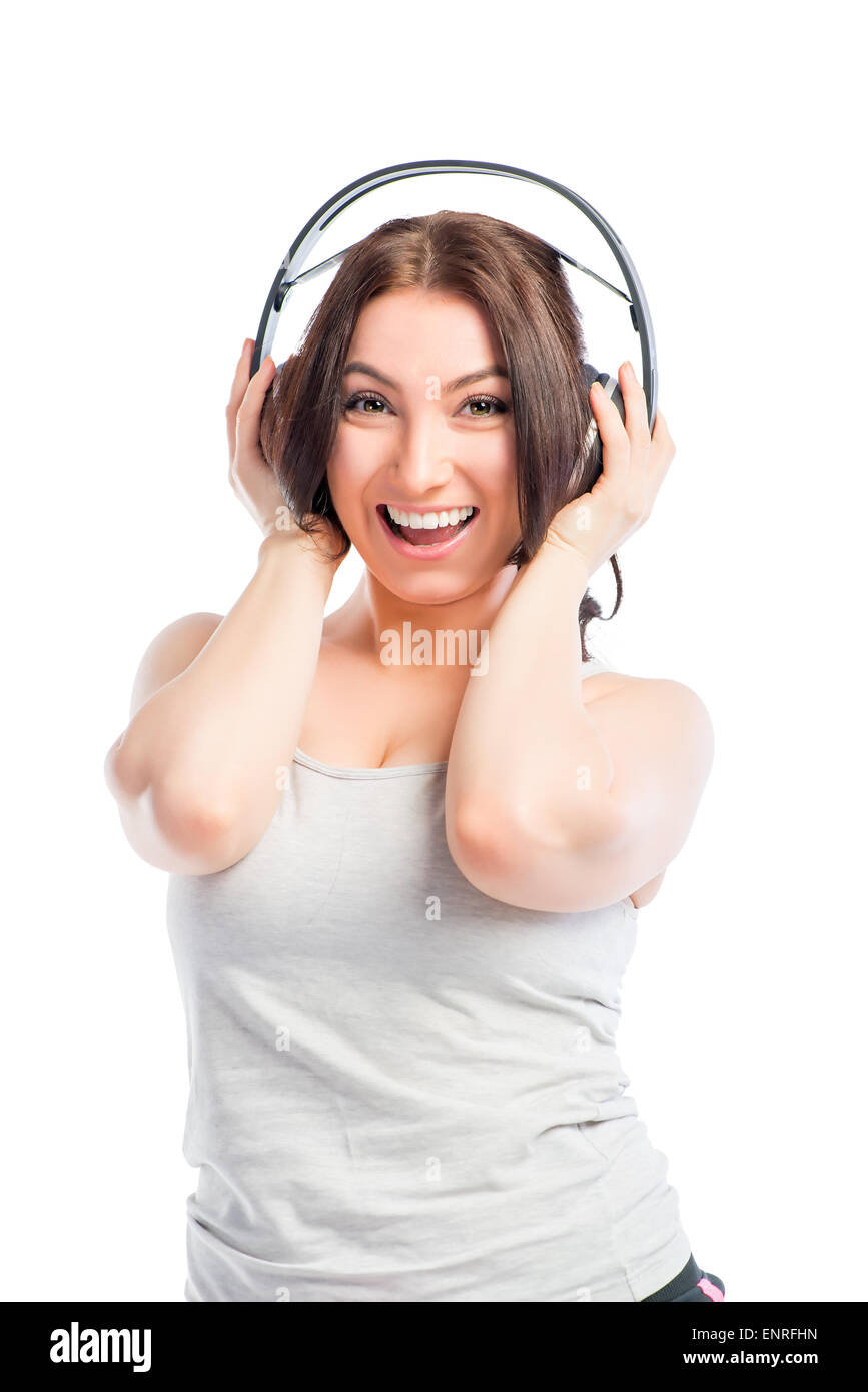 Brunette With Headphones Listening To Music On A White Background Stock