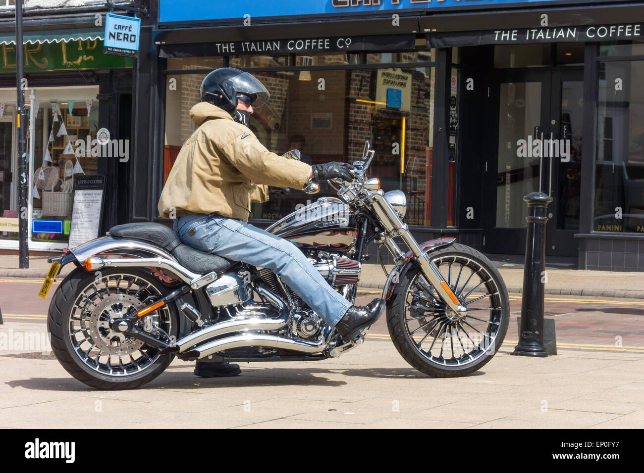 man-riding-away-on-a-2014-harley-davidso