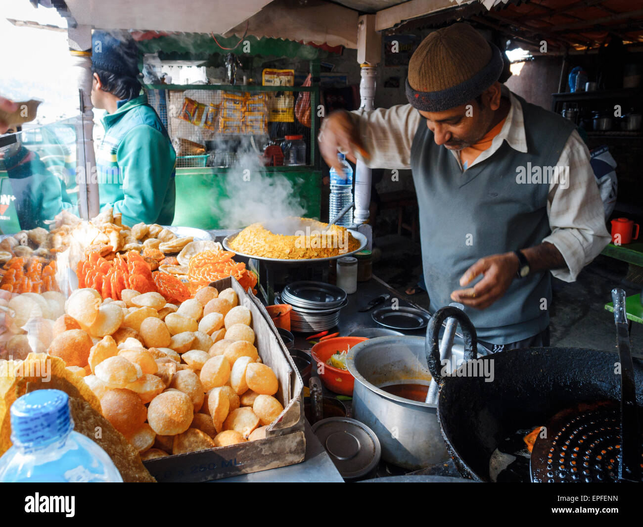Man operating street food cart in Pokhara, Nepal Stock Photo, Royalty