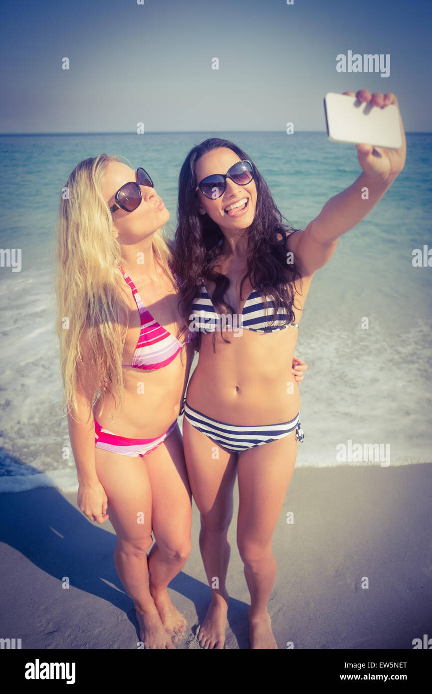 Two Friends In Swimsuits Taking A Selfie Stock Photo Alamy