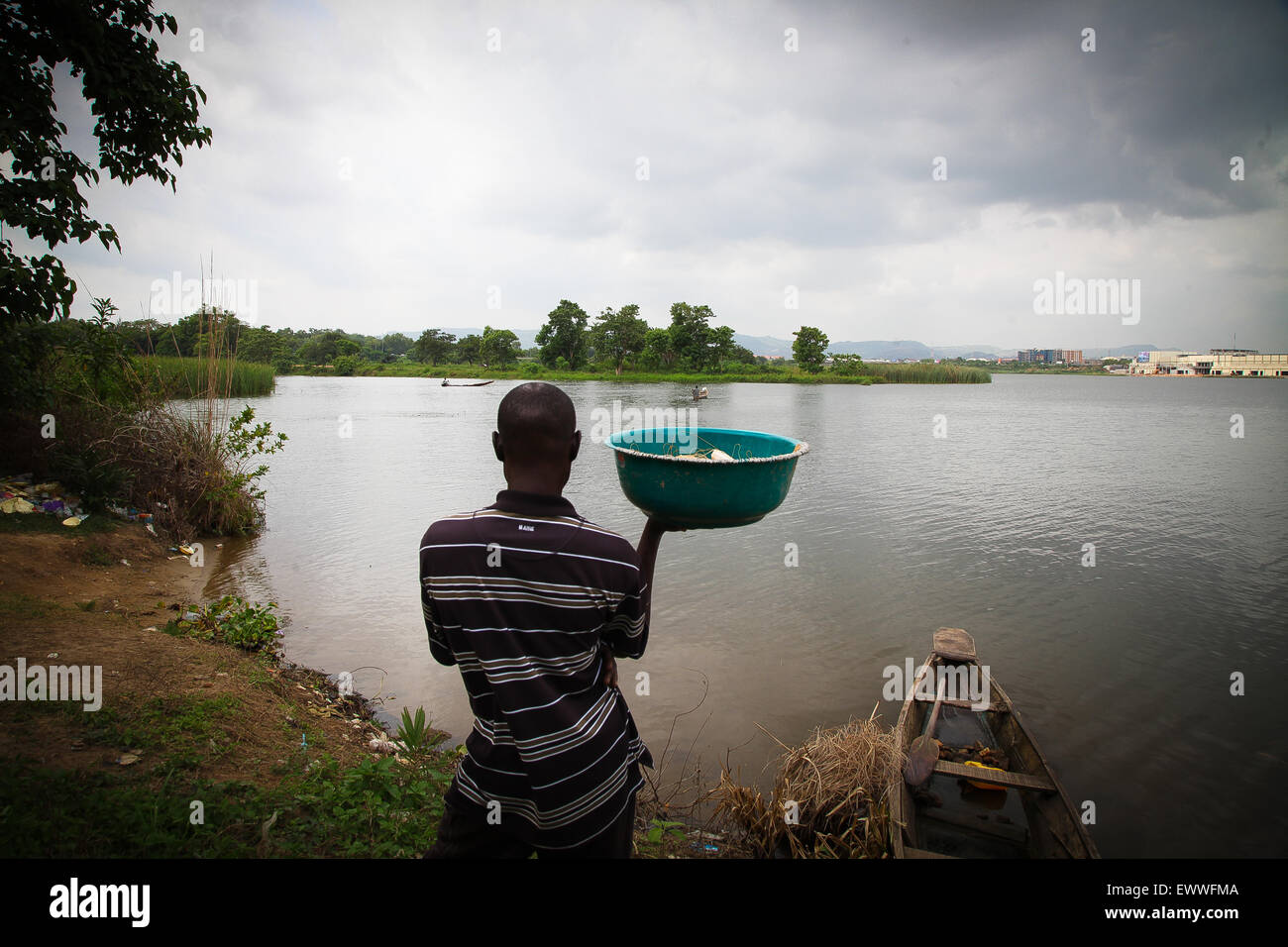 A fisherman fishing at Jabi lake view in Abuja Stock Photo, Royalty