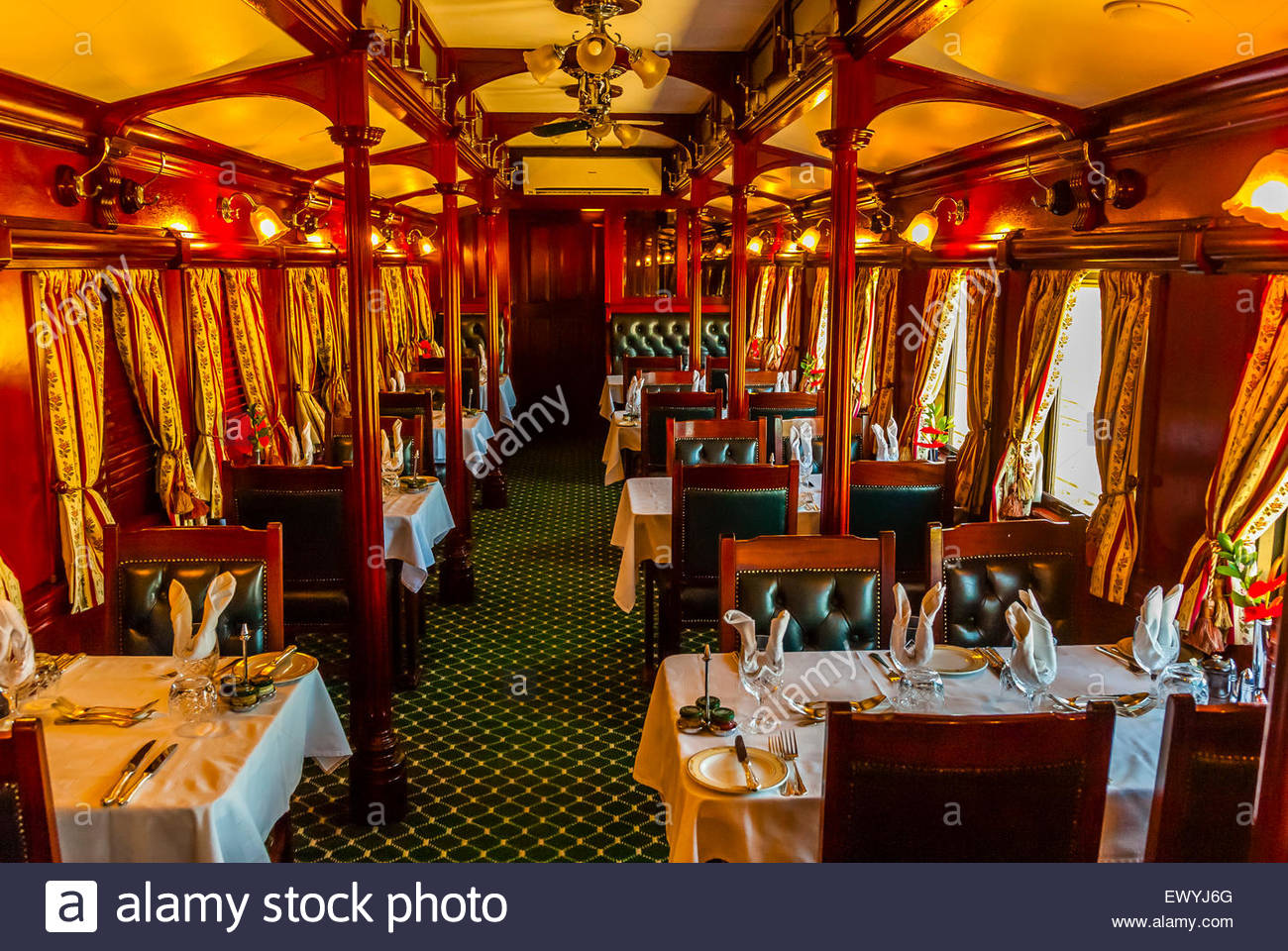 A pillared pre1940s dining car on the luxury Rovos Rail train Stock Photo, Royalty Free Image