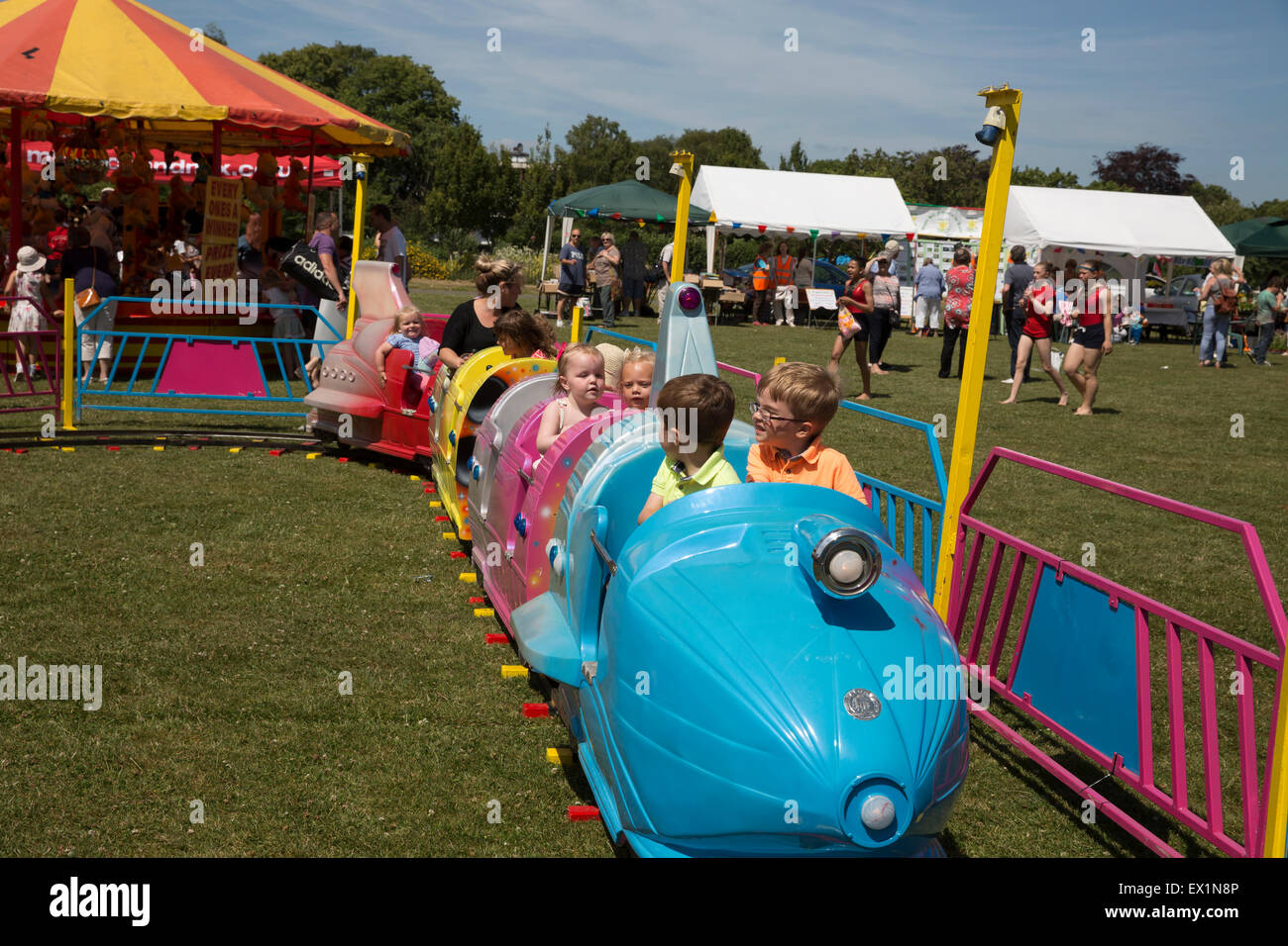 Biggin Hill, UK. 4th July, 2015. Children enjoy a funfair ride at the