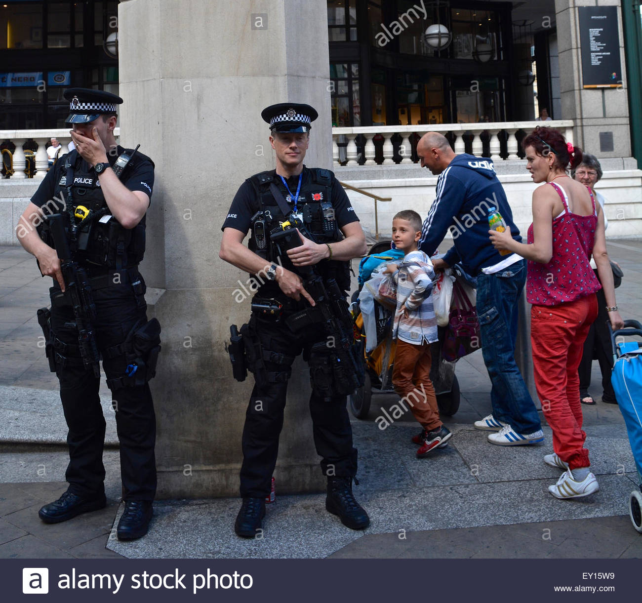 Armed antiterrorist police stand guard outside Liverpool Street Stock
