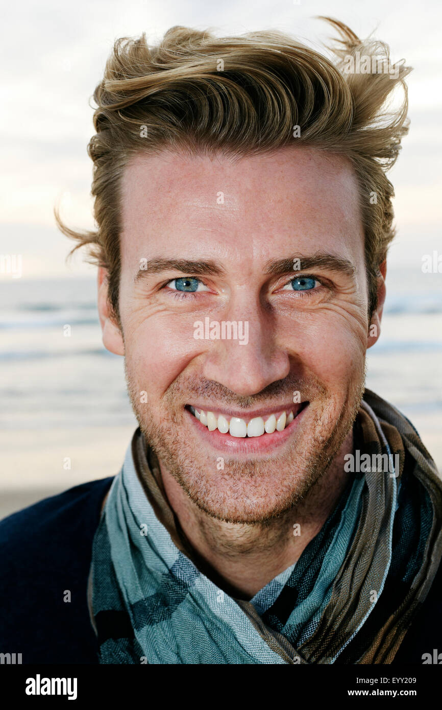 Caucasian Man Smiling On Beach Stock Photo Alamy