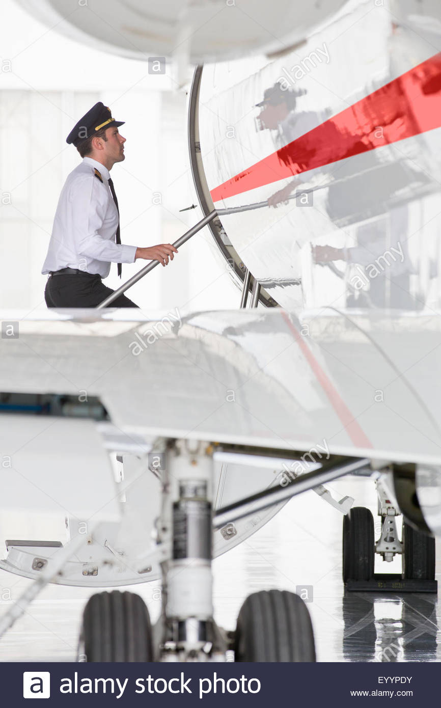 Pilot boarding private jet Stock Photo, Royalty Free Image 86047527