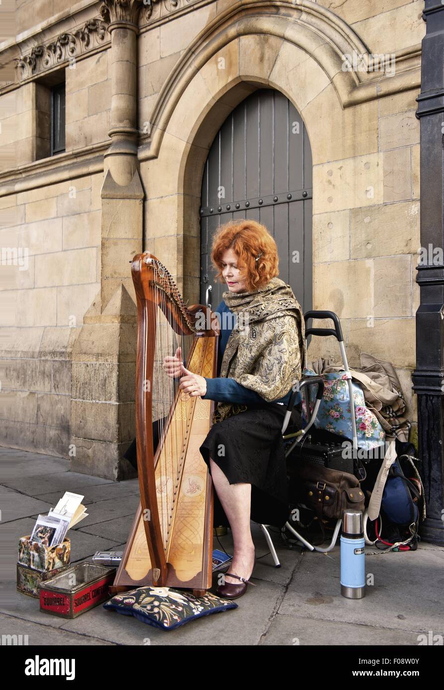 Street musician playing harp, Dublin, Ireland Stock Photo, Royalty Free