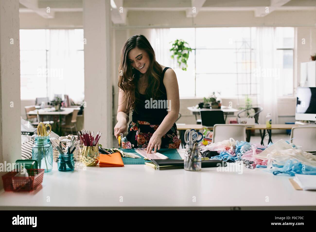 Female textile designer preparing textiles in design studio Stock Photo