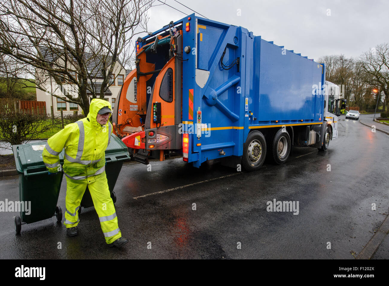 Bin men on thier refuse collection round in a small town in Scotland