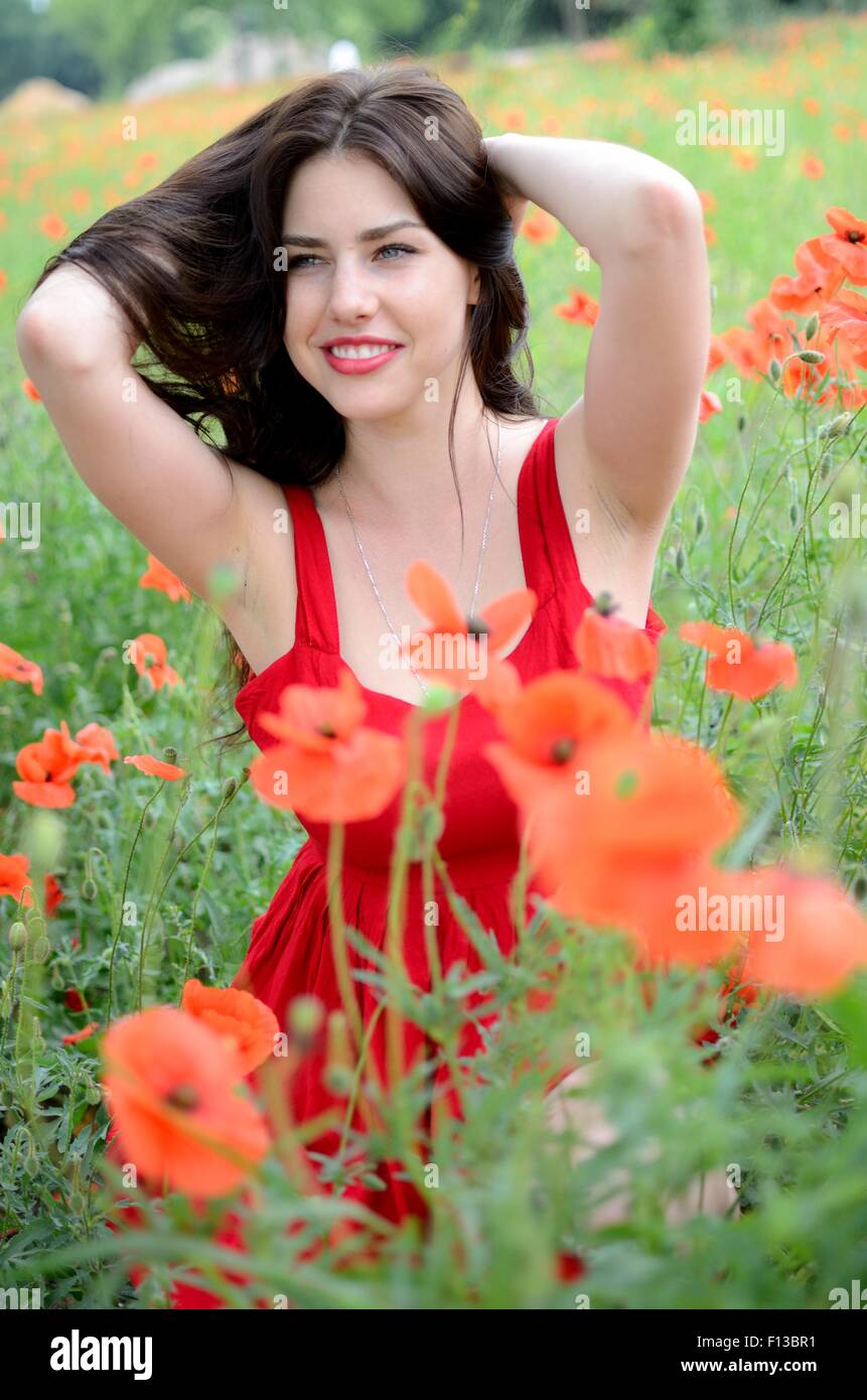 Beautiful Polish Girl Surrounded By Field Full Of Poppies