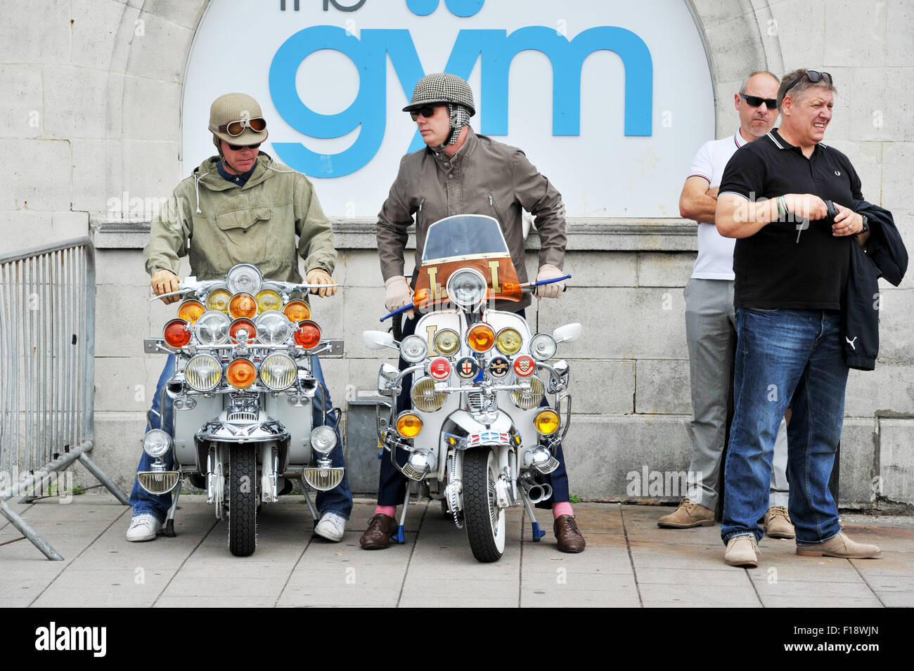 Brighton, UK. 30th August, 2015. Mods with their scooters on Brighton
