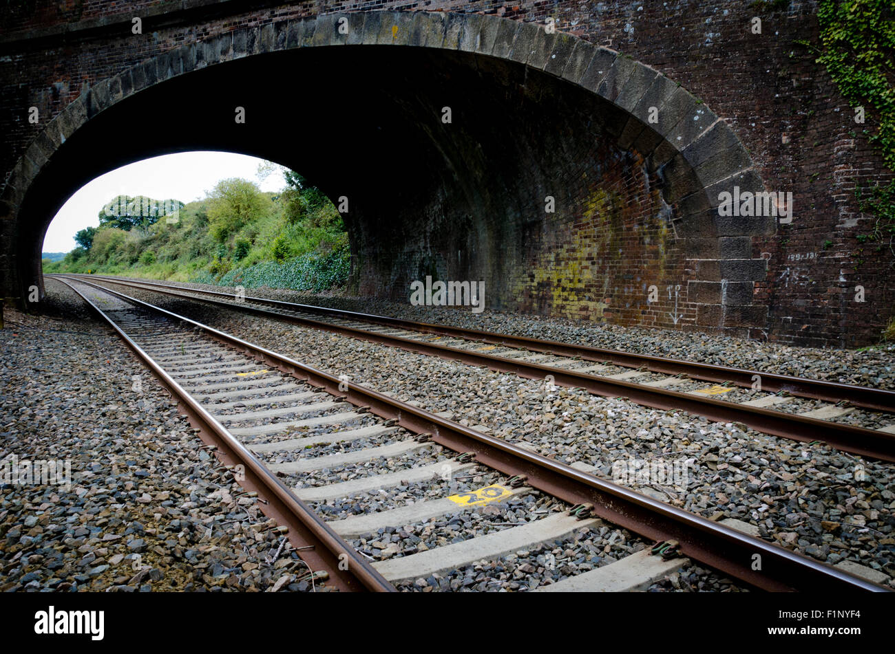 Railway rail tracks under bridge Stock Photo, Royalty Free Image