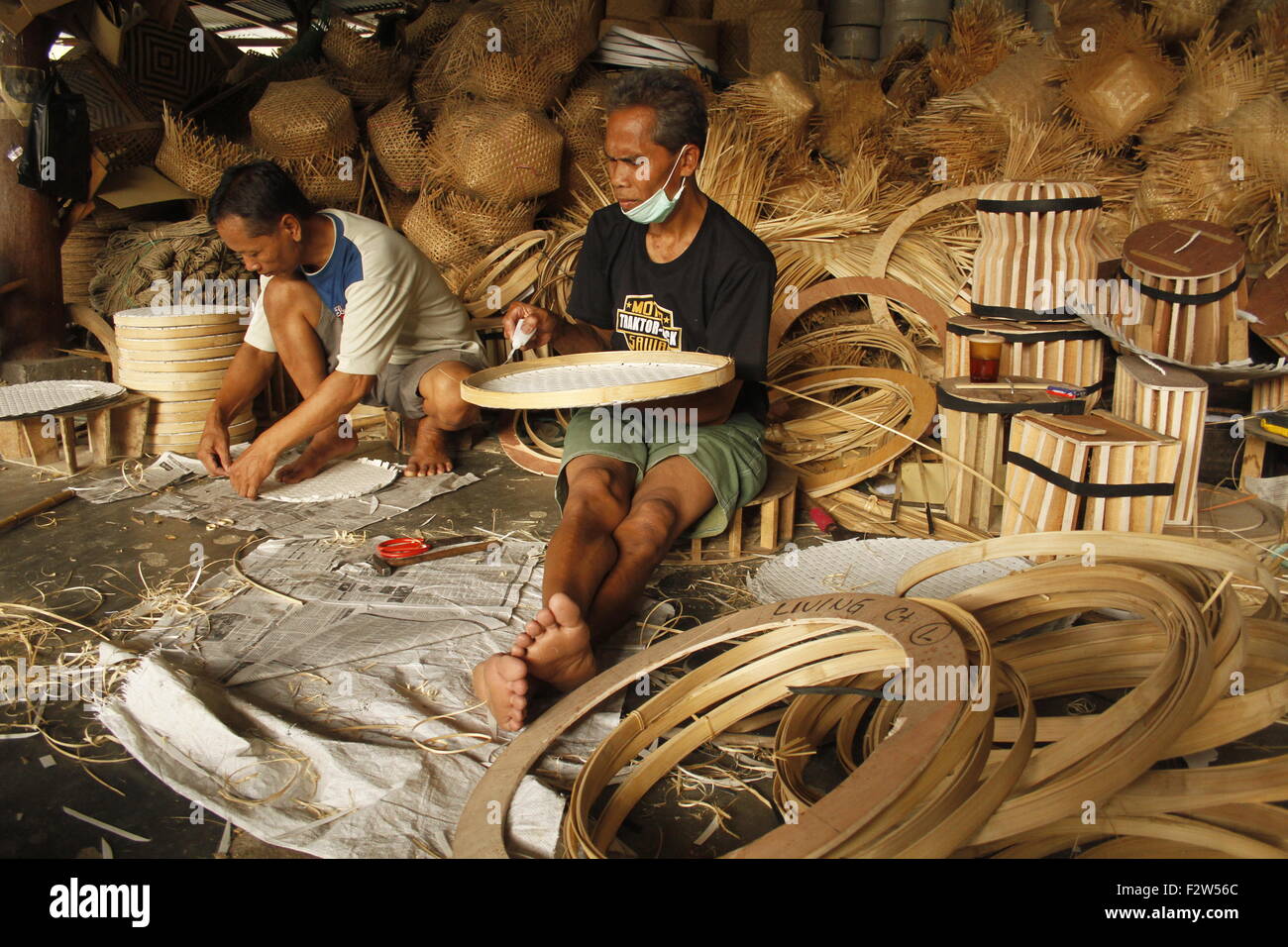 indonesia craftsmen making bamboo handicraft products to maintain a