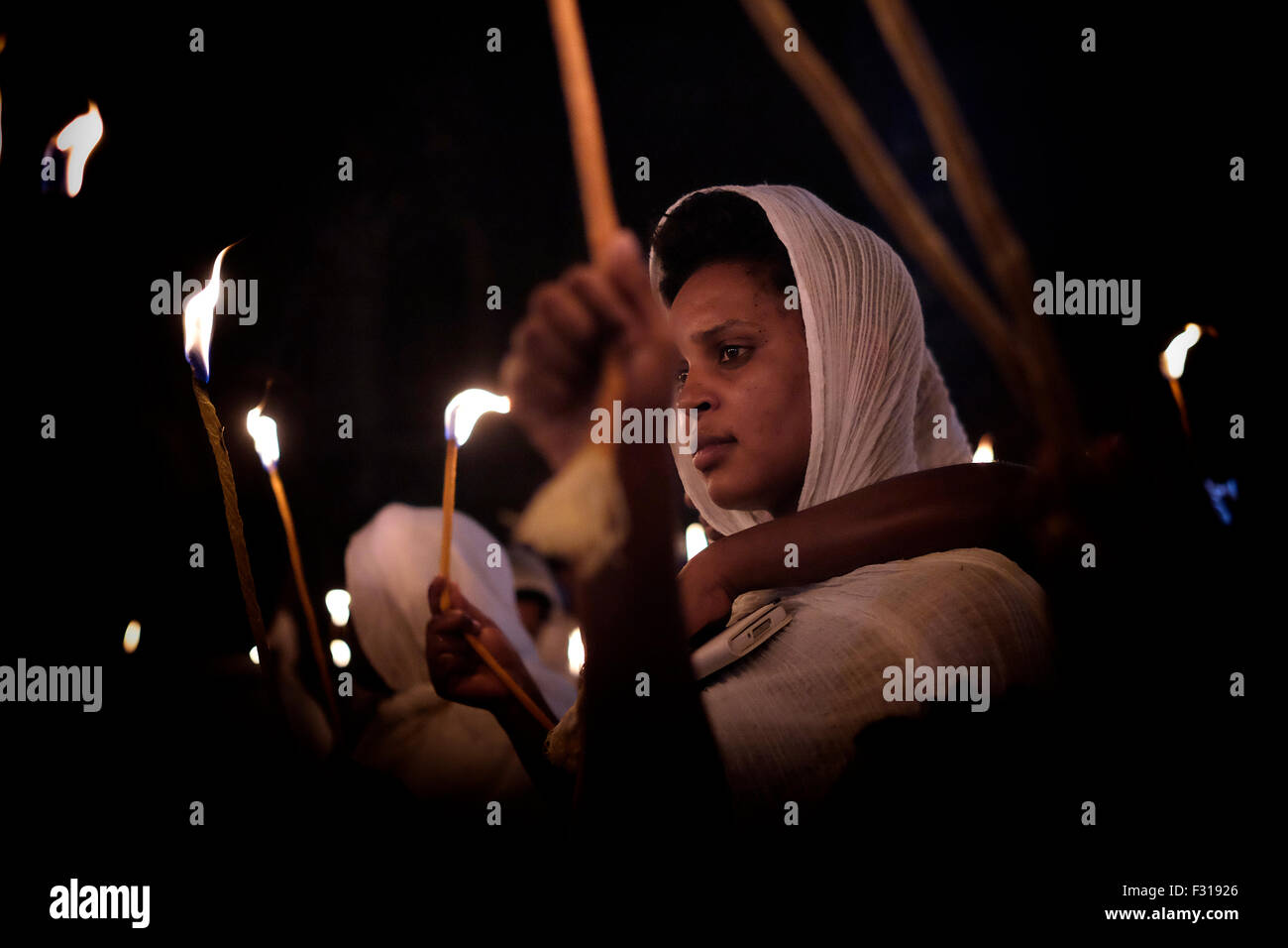 Ethiopian Orthodox Christians Hold Candle As They Celebrate The Demera