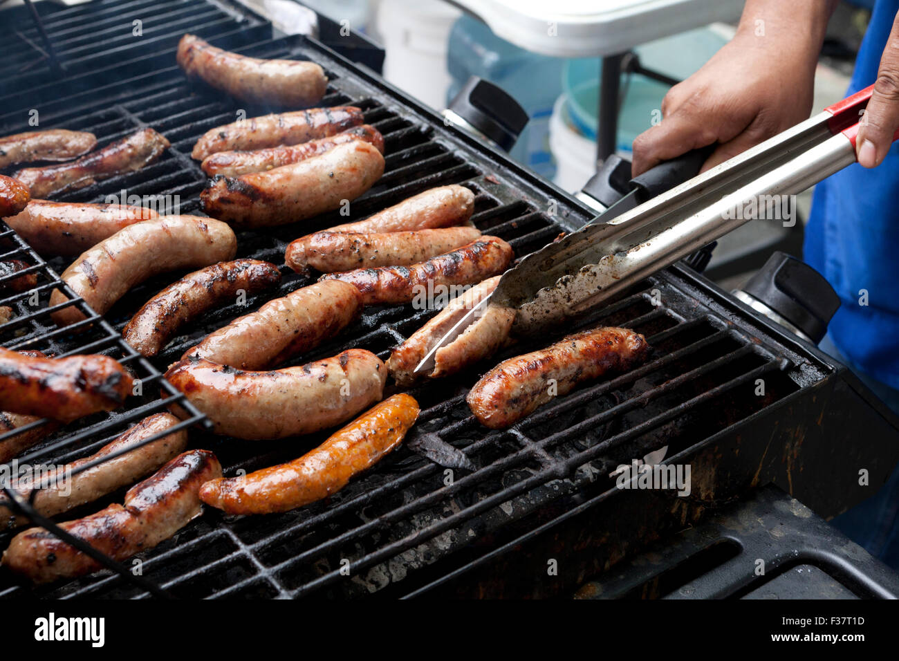 Man Cooking Sausages On Barbecue Grill Usa Stock Photo Alamy