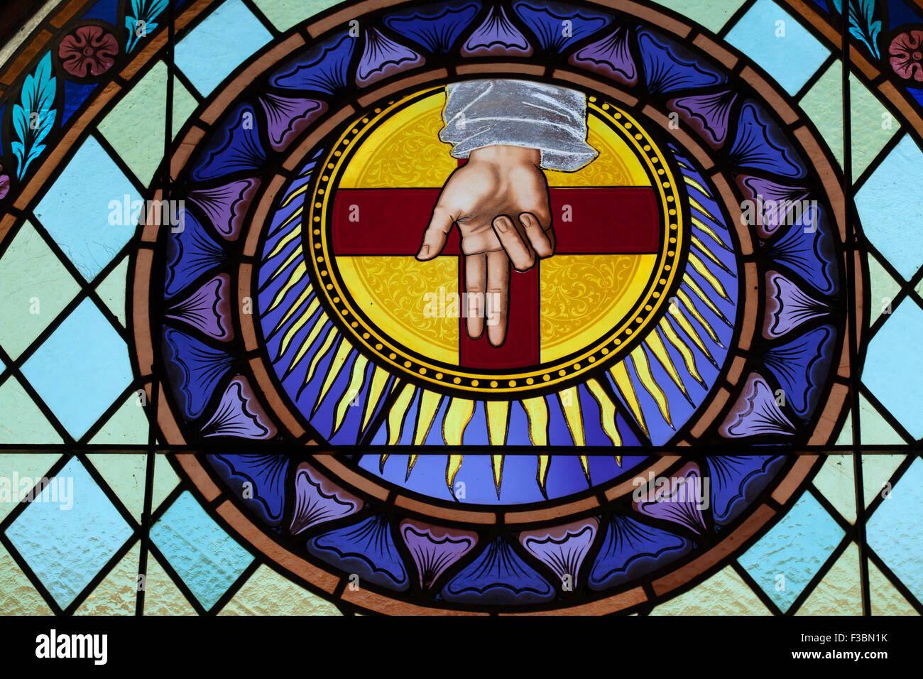 God the Father depicted as the Blessing Hand in the stained glass Stock Photo, Royalty Free
