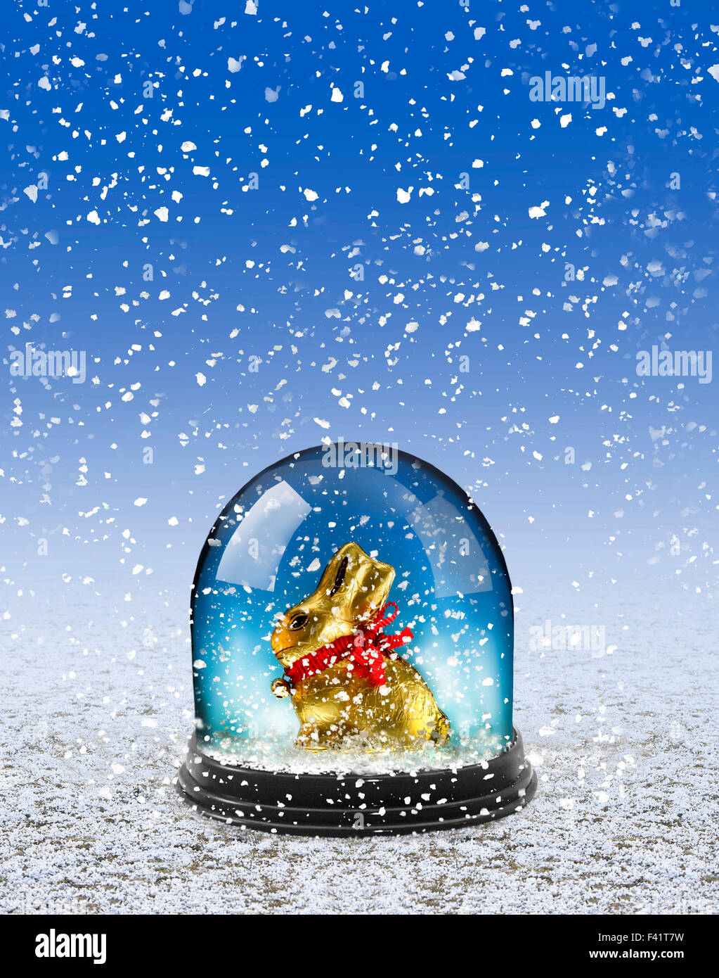 Chocolate Easter bunny in snow globe Stock Photo, Royalty Free Image