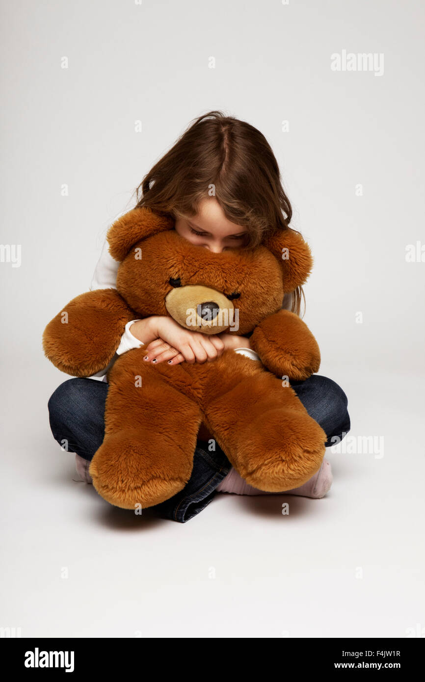 Girl Hugging Her Teddy Bear Stock Photo Alamy