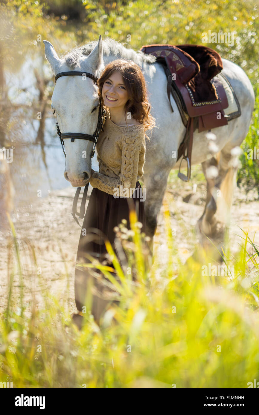 Beautiful girl with the white horse Stock Photo, Royalty Free Image