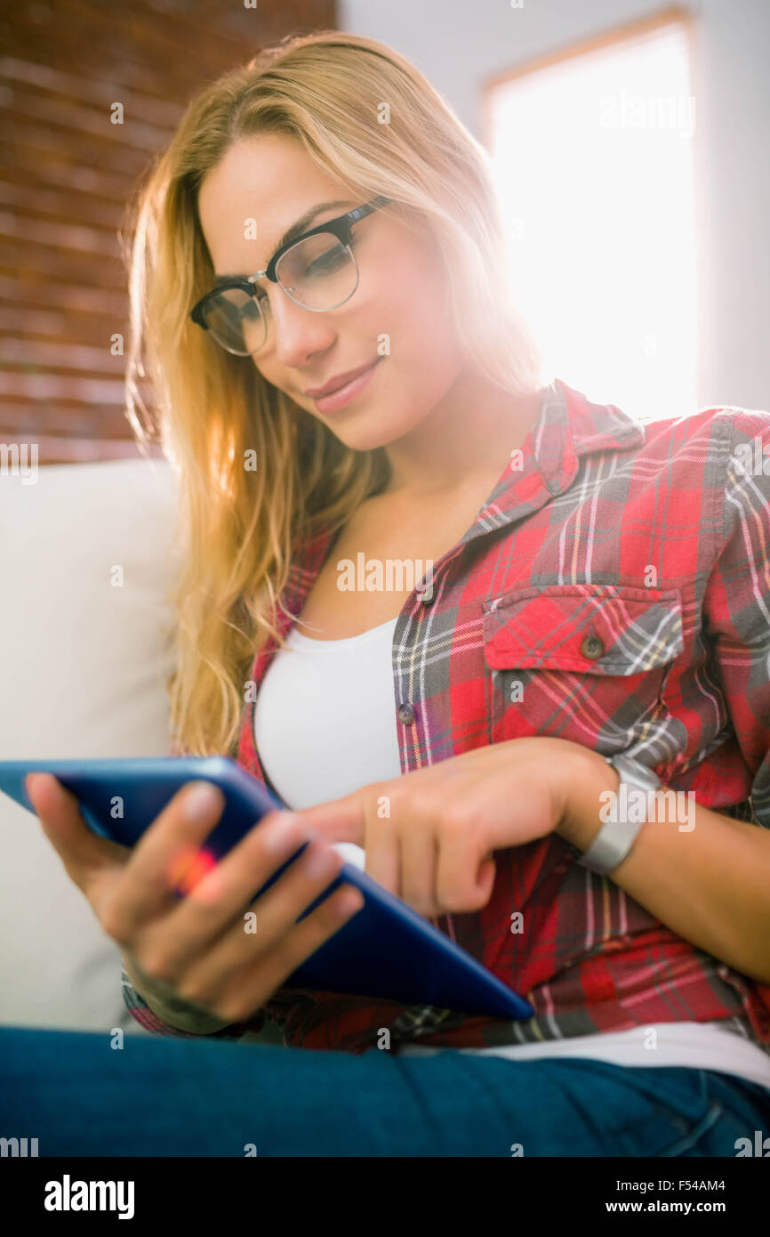 Pretty Blonde Using Tablet On Couch Stock Photo Alamy
