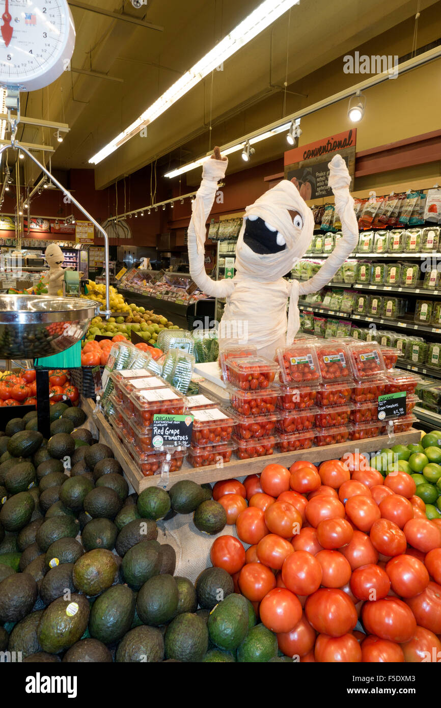 Mummy on display in a grocery store produce department celebrating