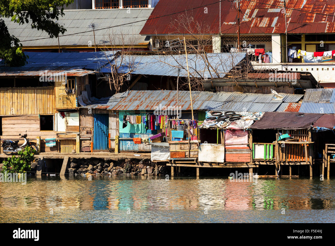 poor houses with sheet tin by the river, Kota Manado, North Sulawesi