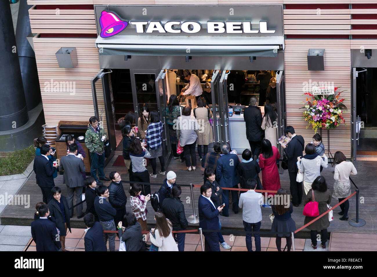Customers line up outside the new Taco Bell branch at the Nippon Stock