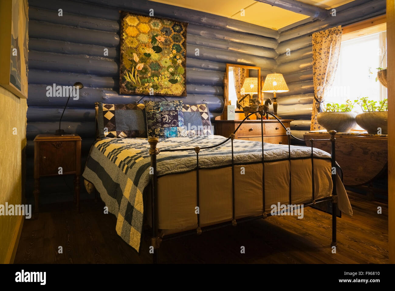 Country Cottage Bedrooms Model Property guest bedroom inside a country cottage style residential log home Country Cottage Bedrooms Model Property guest bedroom inside a country cottage style residential log home