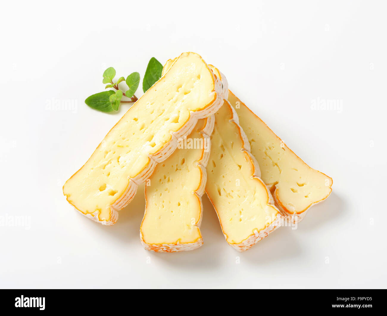 Slices of Alsatian Munster cheese Stock Photo, Royalty Free Image