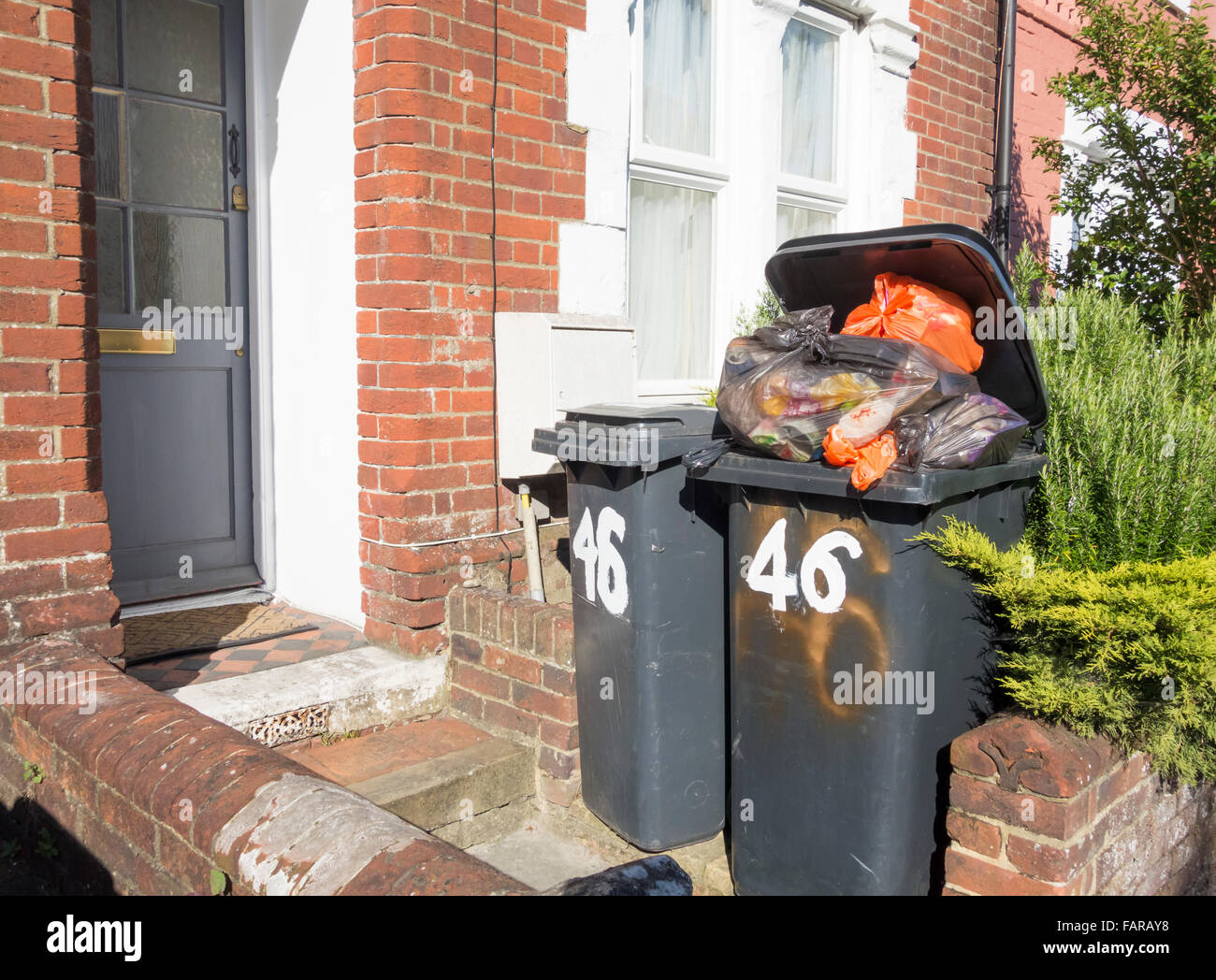 Wheelie bins outside house in Hampshire, England, UK Stock Photo