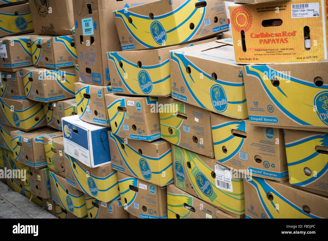 Cardboard boxes, mostly from Chiquita brand bananas, awaiting pick up