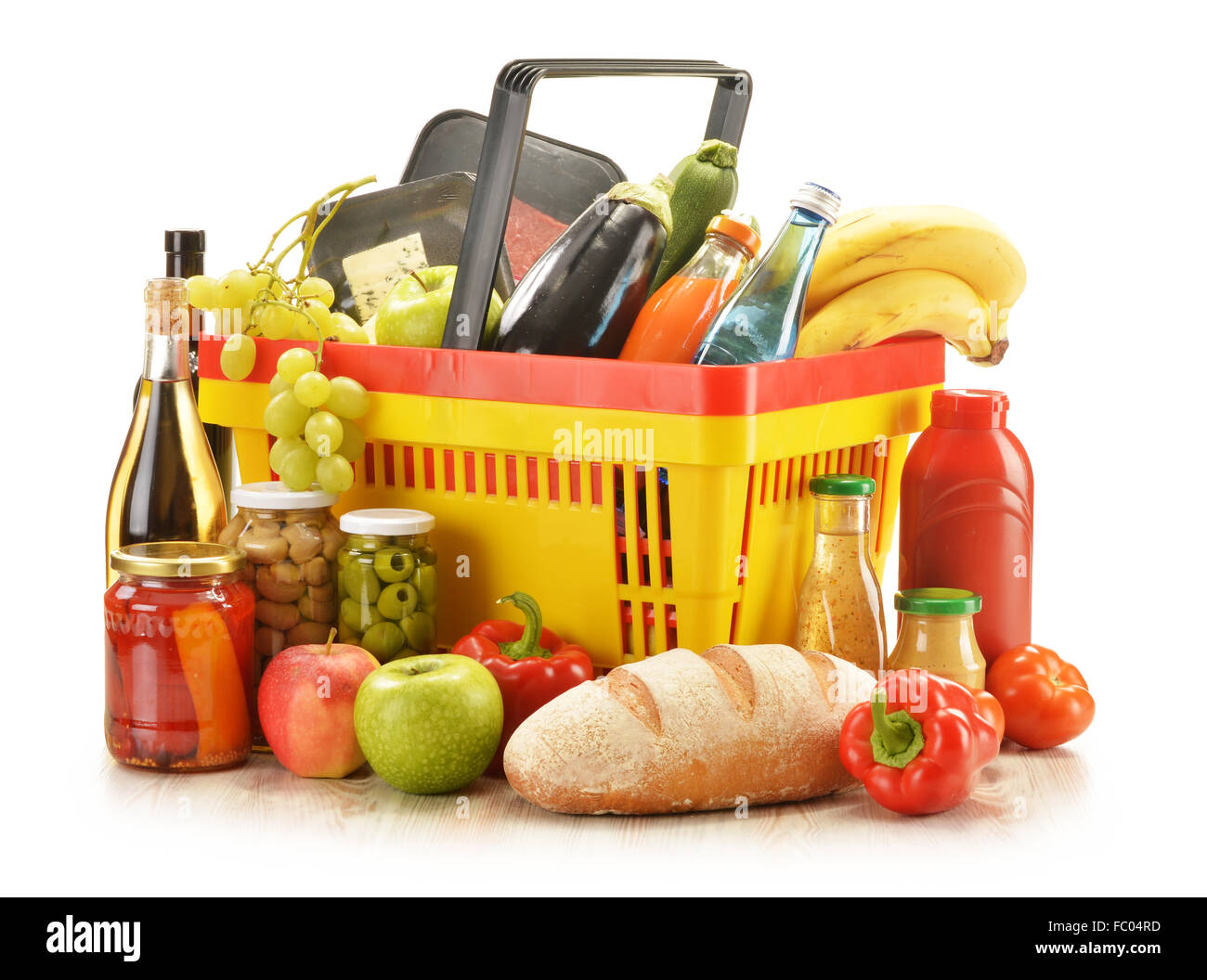 Composition with grocery products in shopping basket Stock Photo