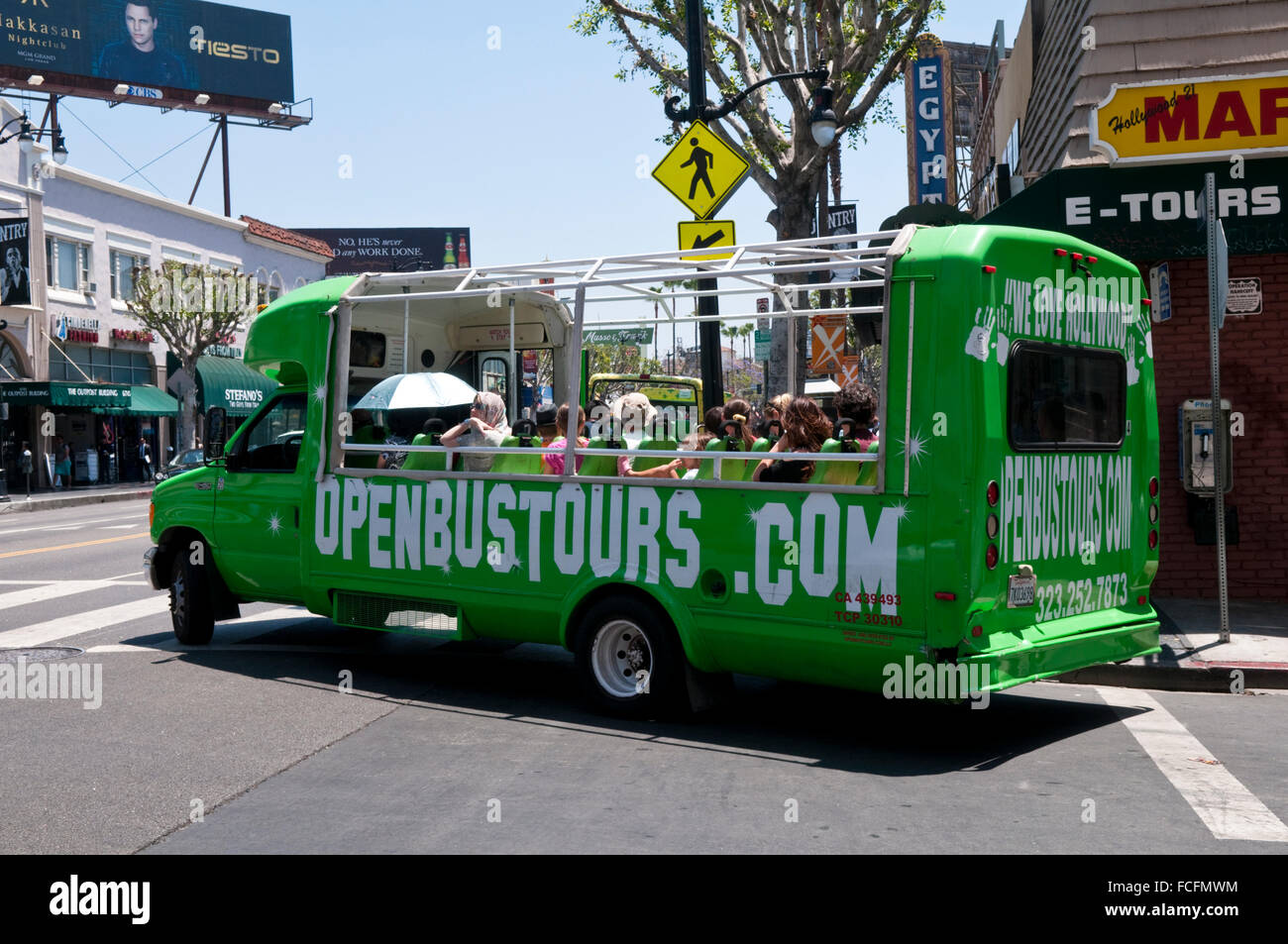 A green Open Bus Tours tourist bus taking sightseers around Stock Photo