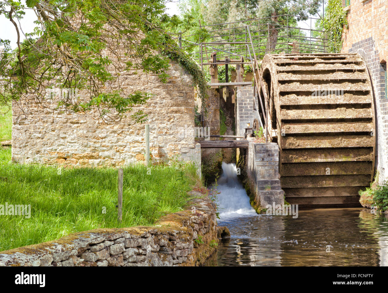 old-stone-water-mill-with-wooden-waterwh