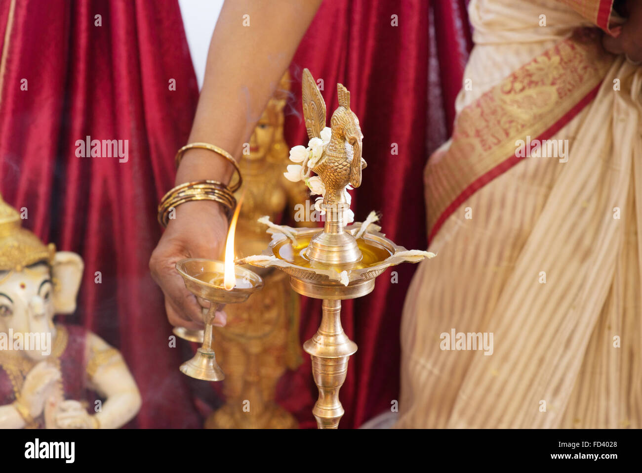Woman lighting up the metal diya. Traditional Indian Hindus ... for Lamp Lighting Ceremony
303mzq Woman lighting up the metal diya. Traditional Indian Hindus ... for Lamp Lighting Ceremony
303mzq