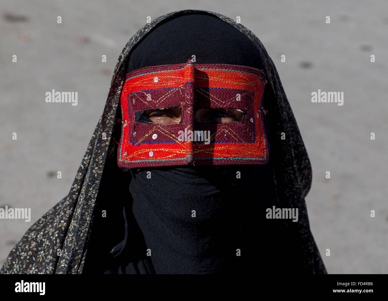 A Bandari Woman Wearing The Traditional Mask Called The Burqa On A Market Hormozgan Bandar