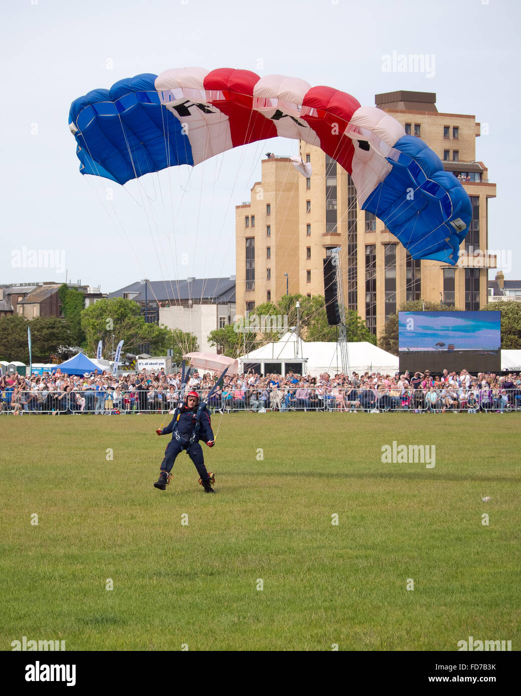 A Member Of The RAF Falcons Parachute Display Team Makes A Landing On