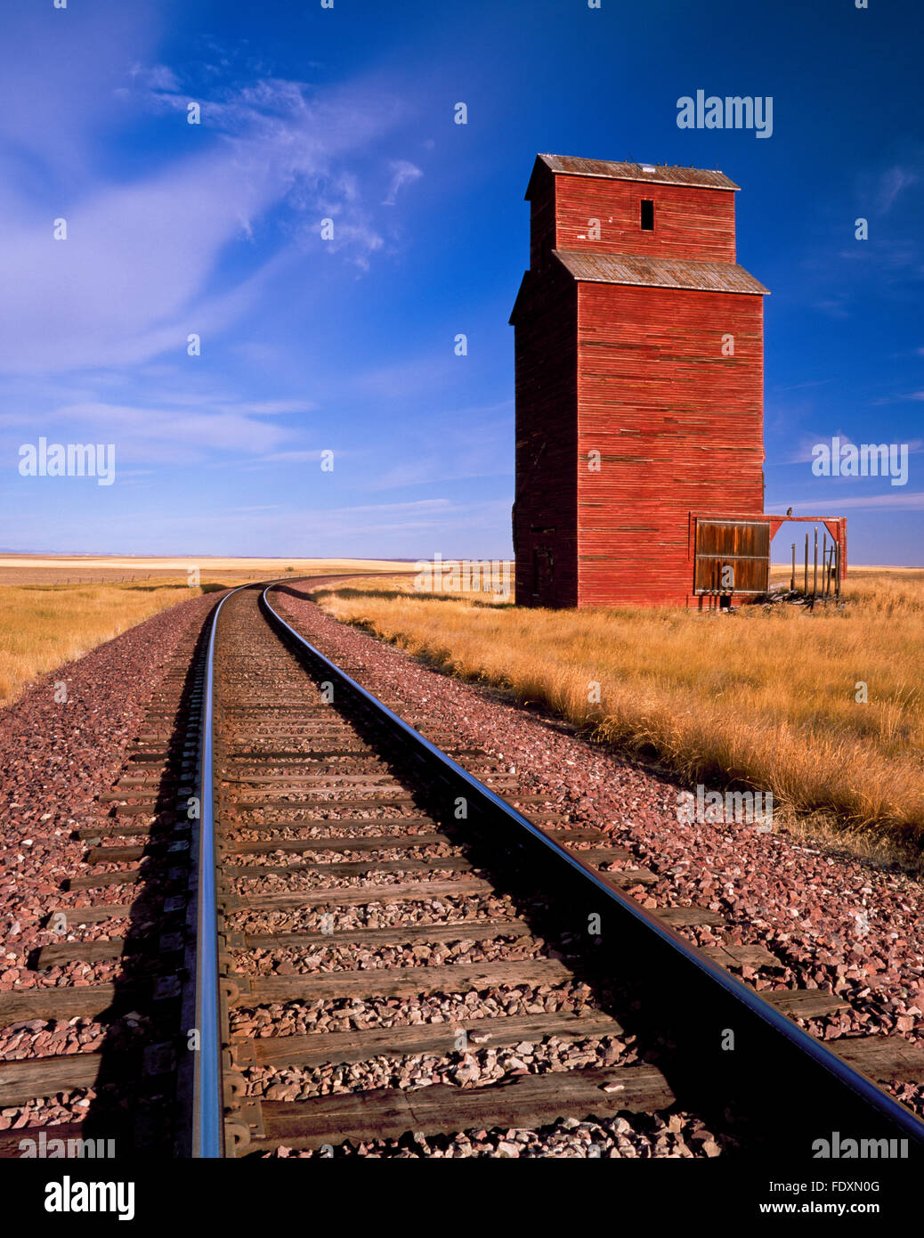 old grain elevator and railroad tracks near dutton, montana Stock Photo