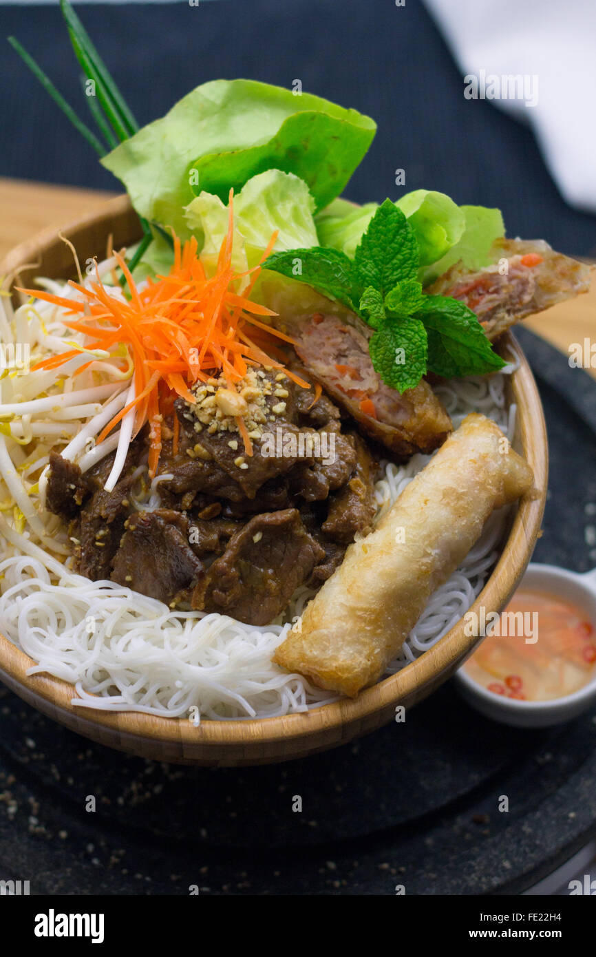 Bun Thit Vietnamese Rice Vermicelli in Wooden Bowl with Salad, Pork