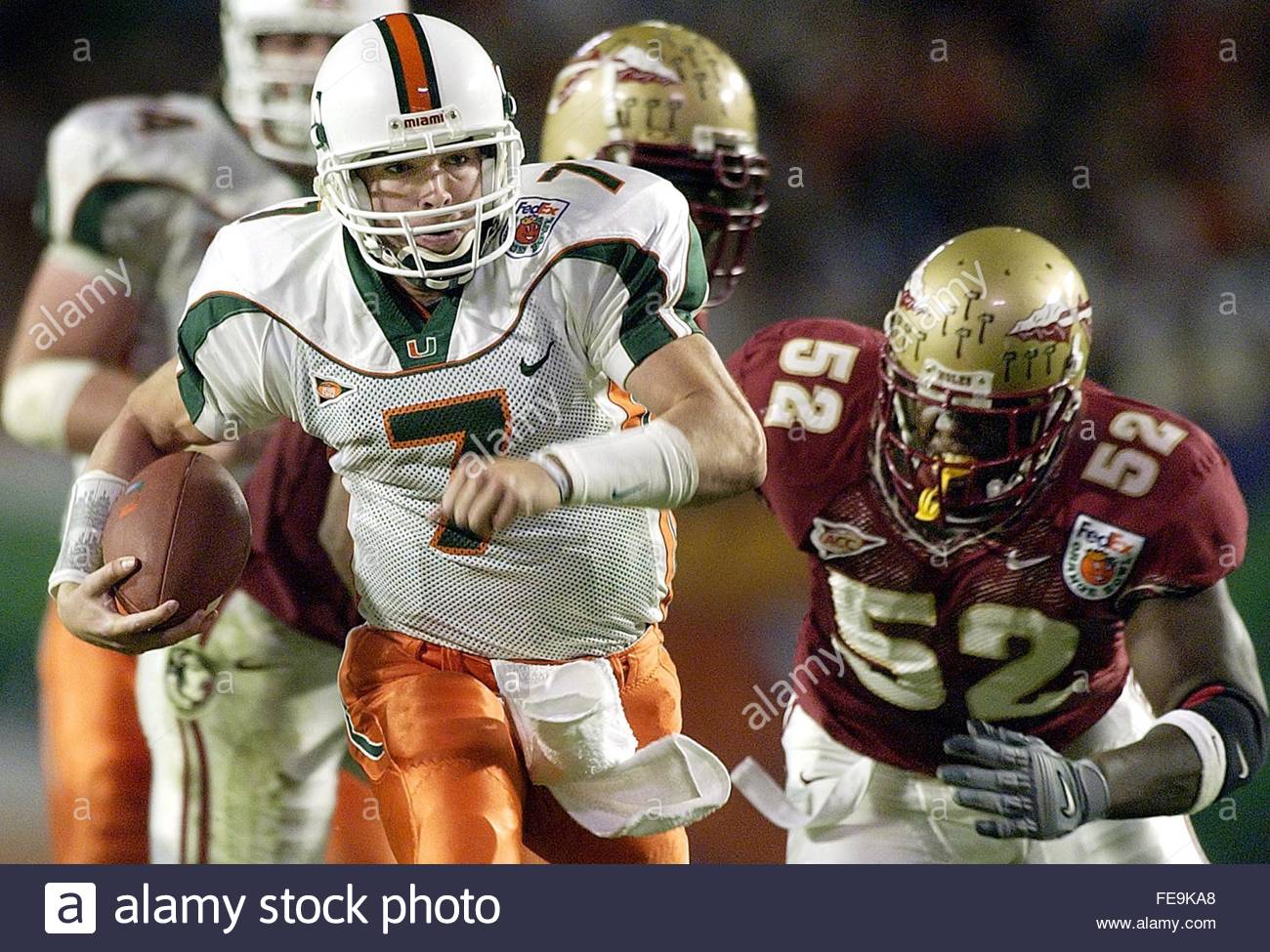miami-hurricanes-quarterback-brock-berlin-l-scrambles-away-from-florida-FE9KA8.jpg