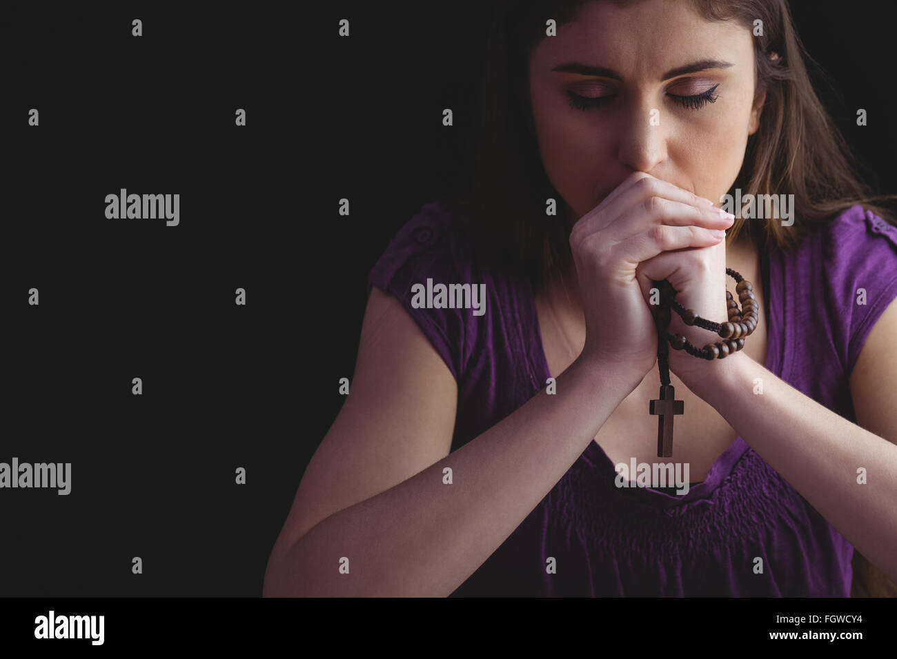 Woman Praying With Wooden Rosary Beads Stock Photo Alamy