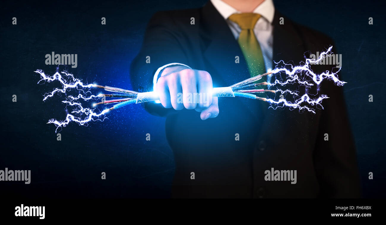 Business Person Holding Electrical Powered Wires Stock Photo Alamy