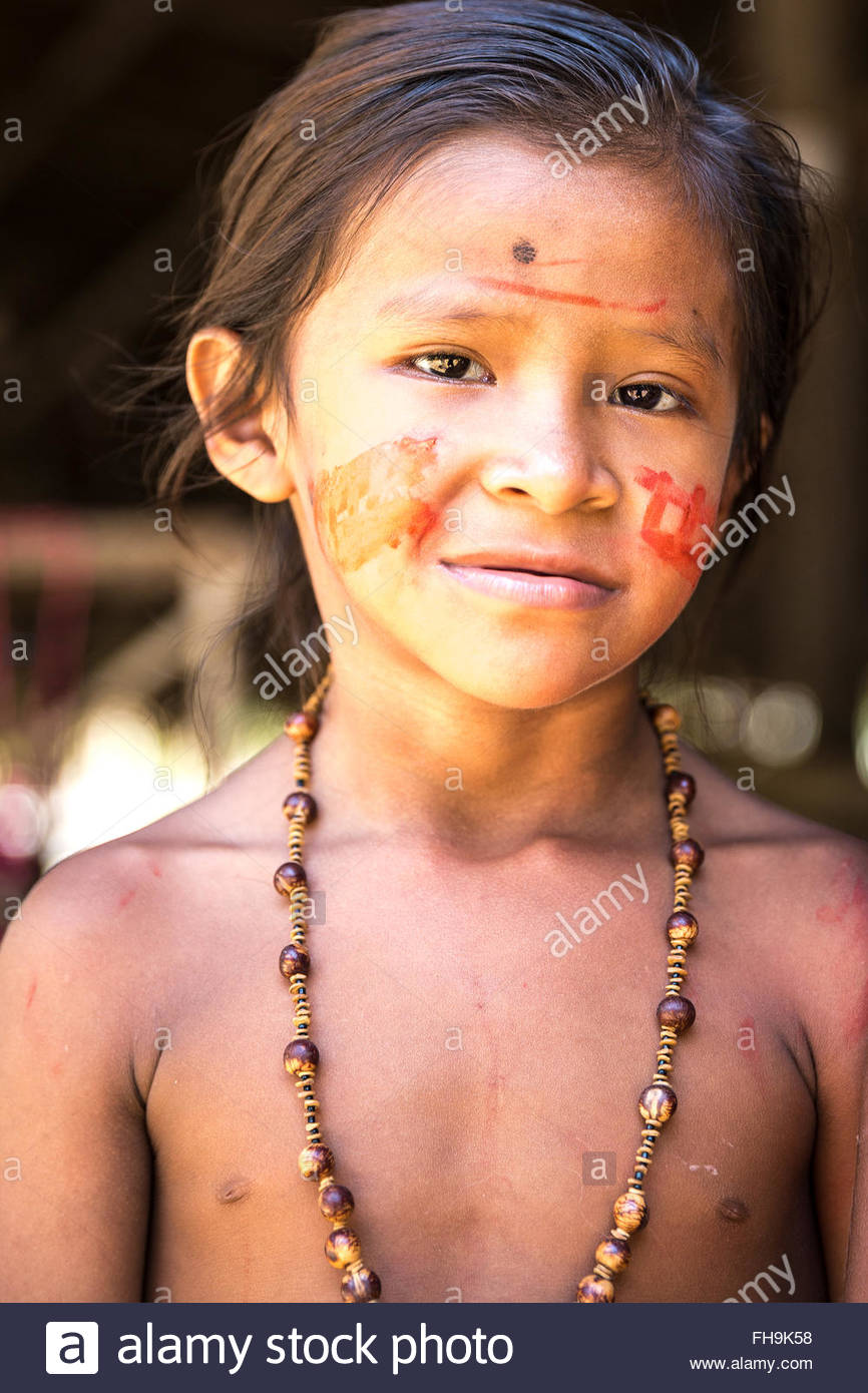 Native Brazilian Girl Smiling At An Indigenous Tribe In The Amazon